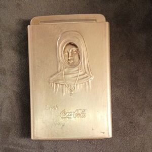 1915 Coca-Cola Metallic Gold Embossed Nun Ciger Cutter Belt Buckle